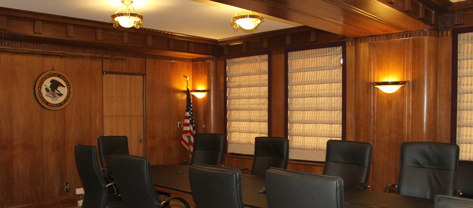 An old wood paneled conference room that has been used for many business meetings