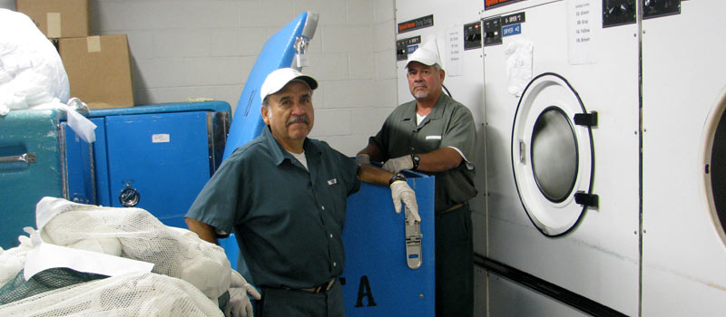 Inmates working in the laundry facilities.