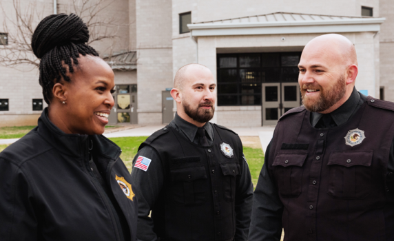 correctional officers talking outside