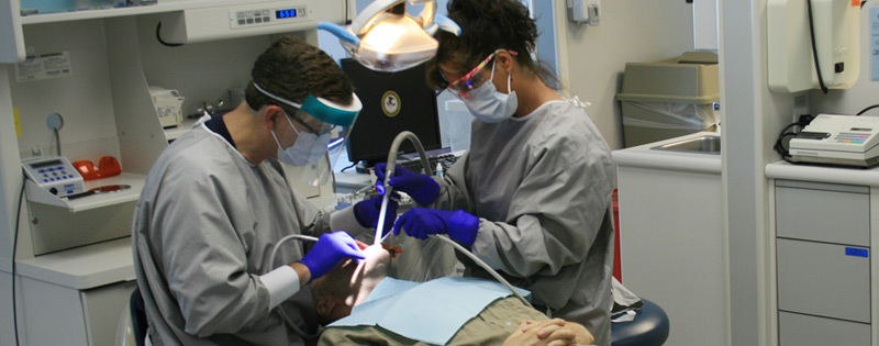 BOP Dental Officers working on an inmate