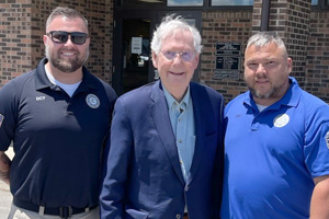 U.S. Senator Mitch McConnell poses for photo with BOP staff