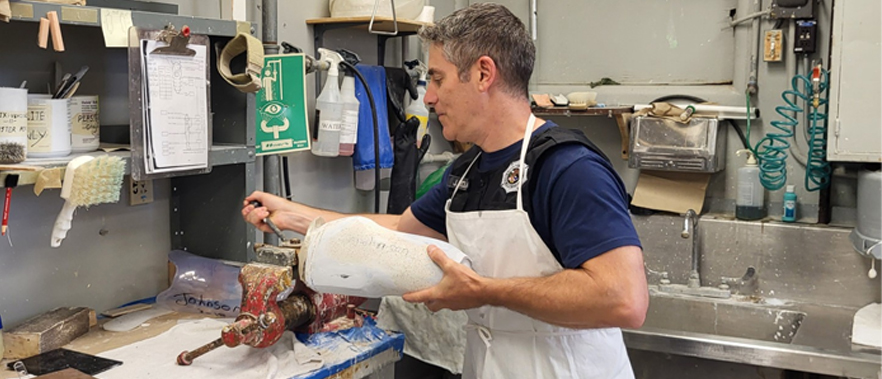 BOP staff working in a prosthetic lab at MCFP Springfield, Missouri