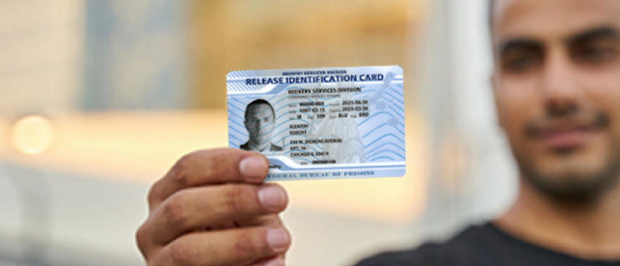 Man holding new Federal ID Card