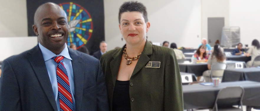 Abar Rouse, with fellow FMC Carswell employee Dove Baine, during an inmate mock job fair sponsored by the institution's Education Department.