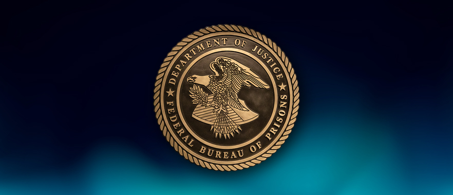 Federal Bureau of Prisons seal over blue background